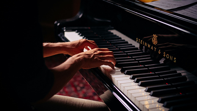 Person Playing Piano