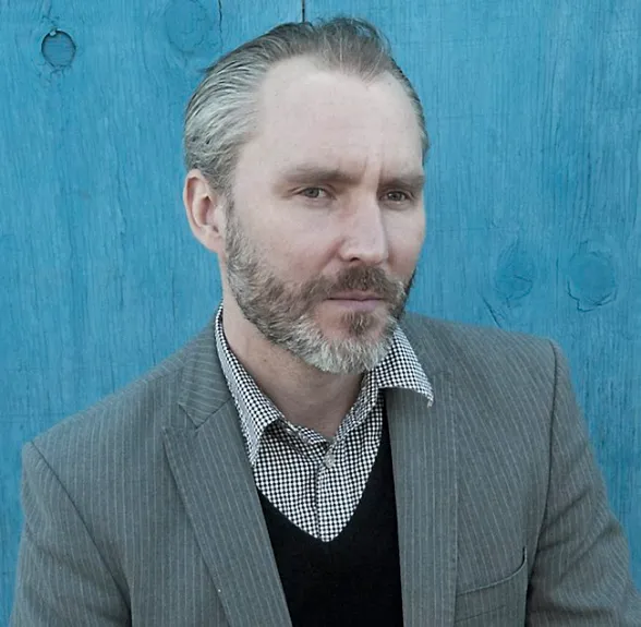 Headshot of Reid Anderson