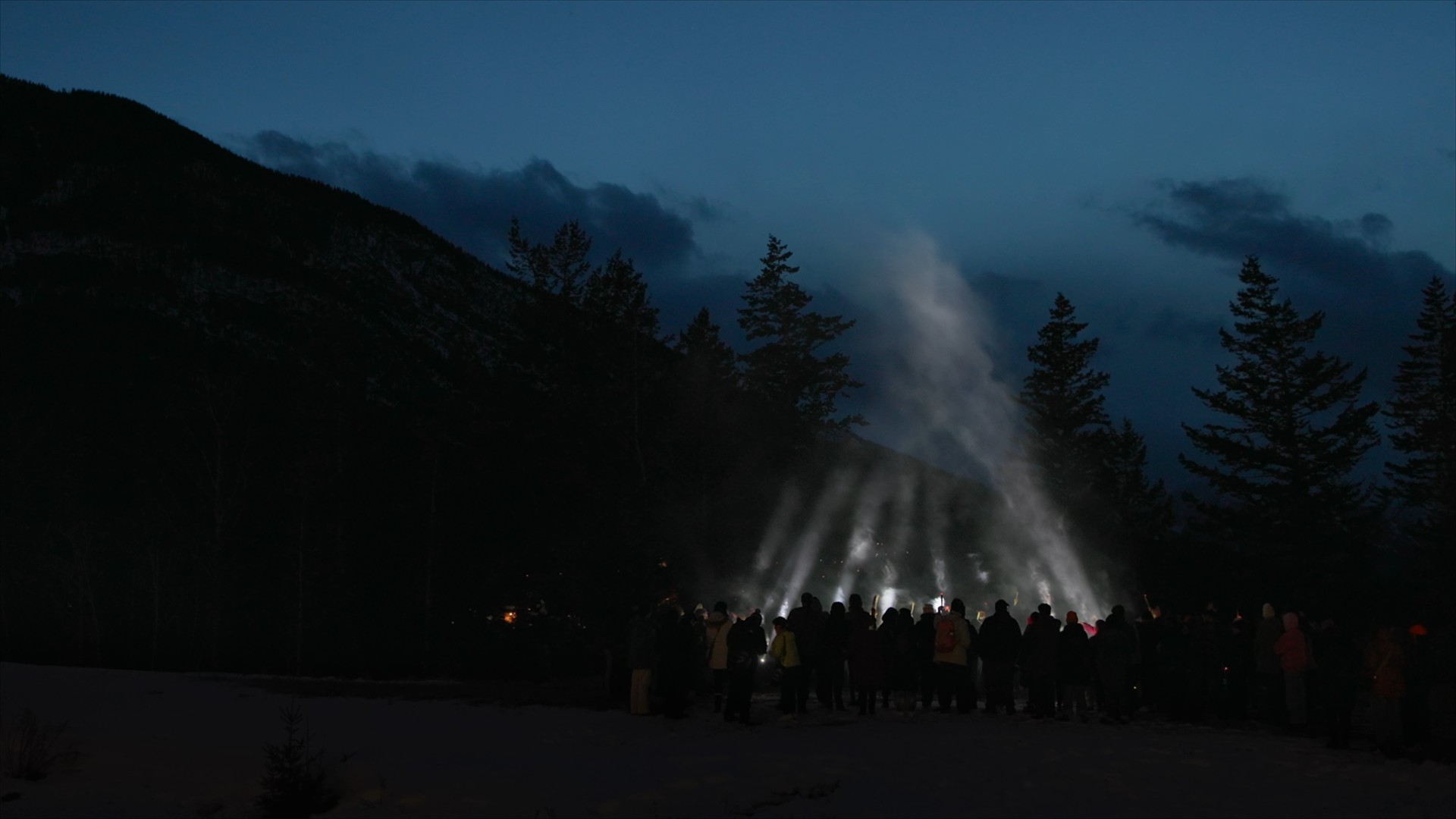 Cover of Reflections 25-26 - Beams of light create a tipi shape against a mountainous night sky