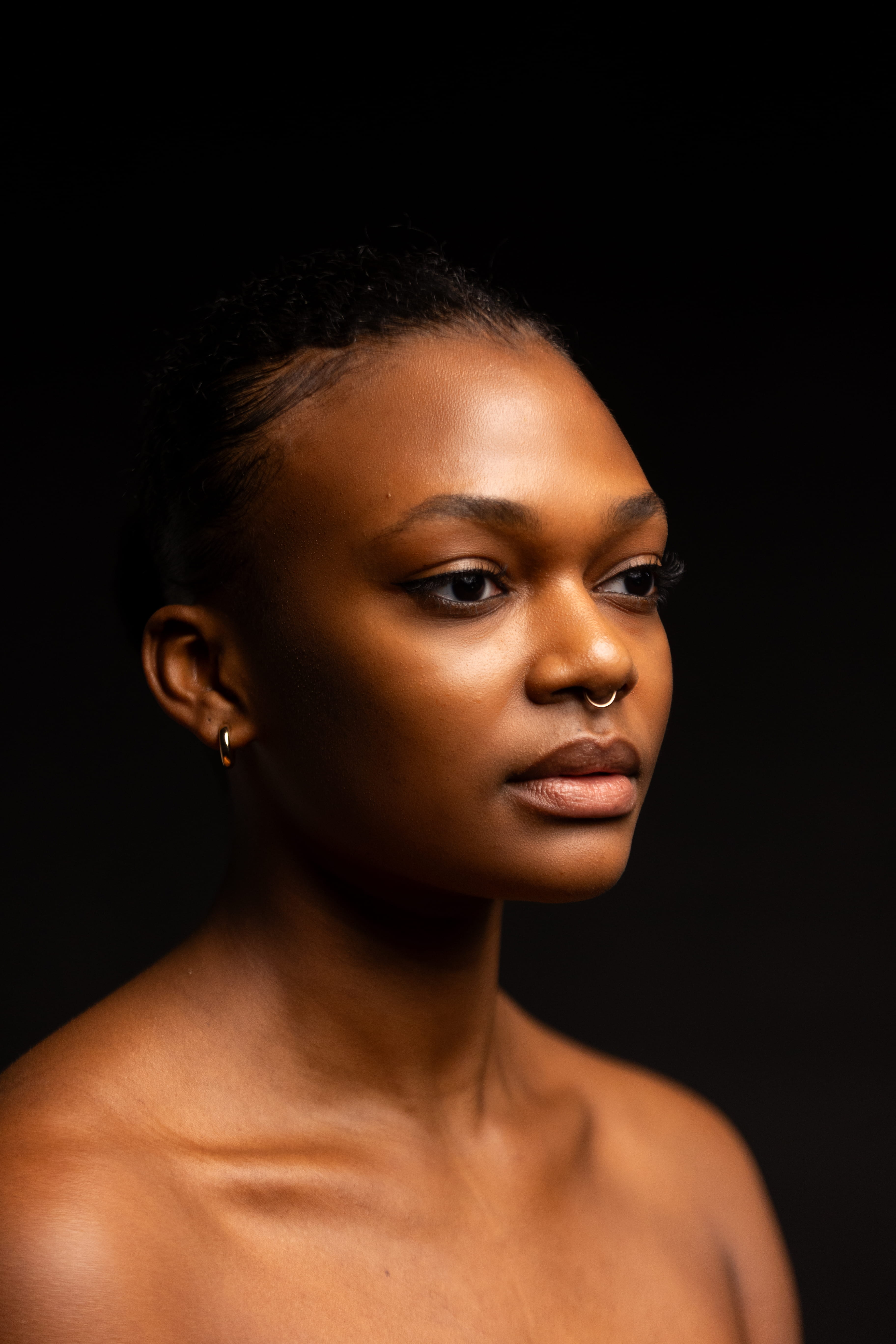 side portrait shoulders up of dancer looking off to side 