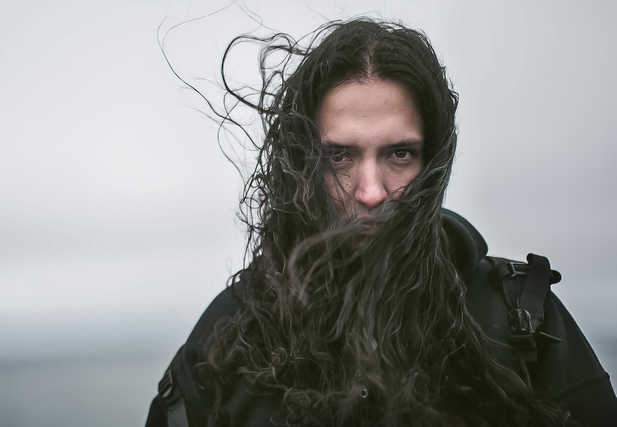 Man with long hair in the wind