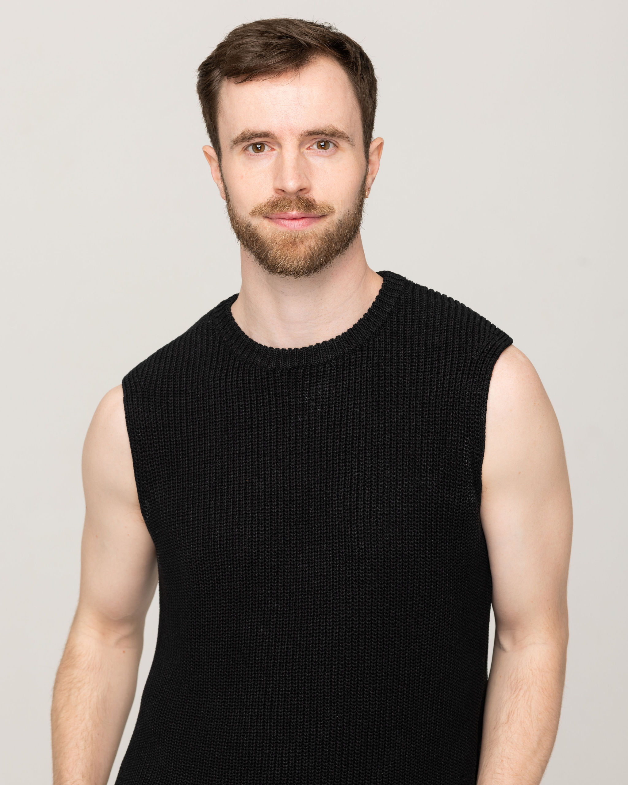 Male dancer in a black vest 