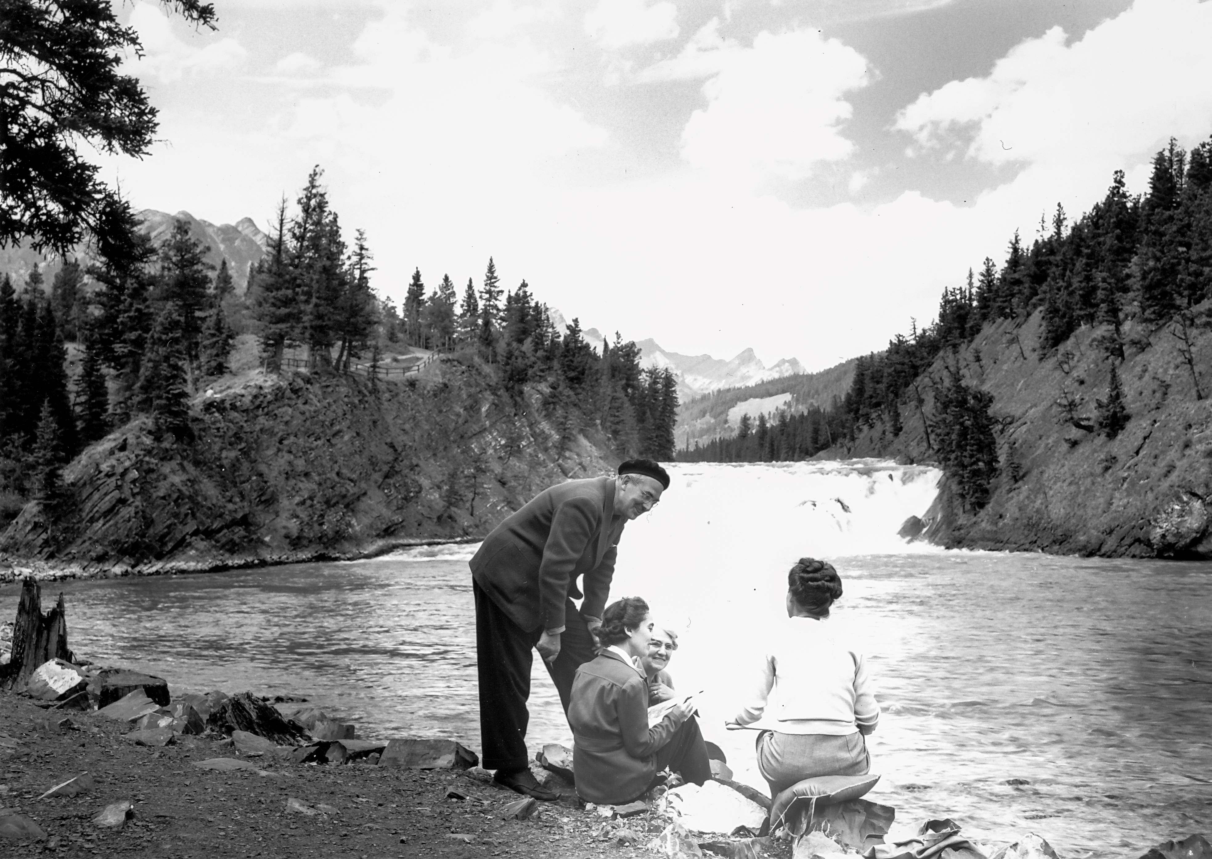 Walter J. Phillips with landscape painting students at the base of Bow Falls in 1947
