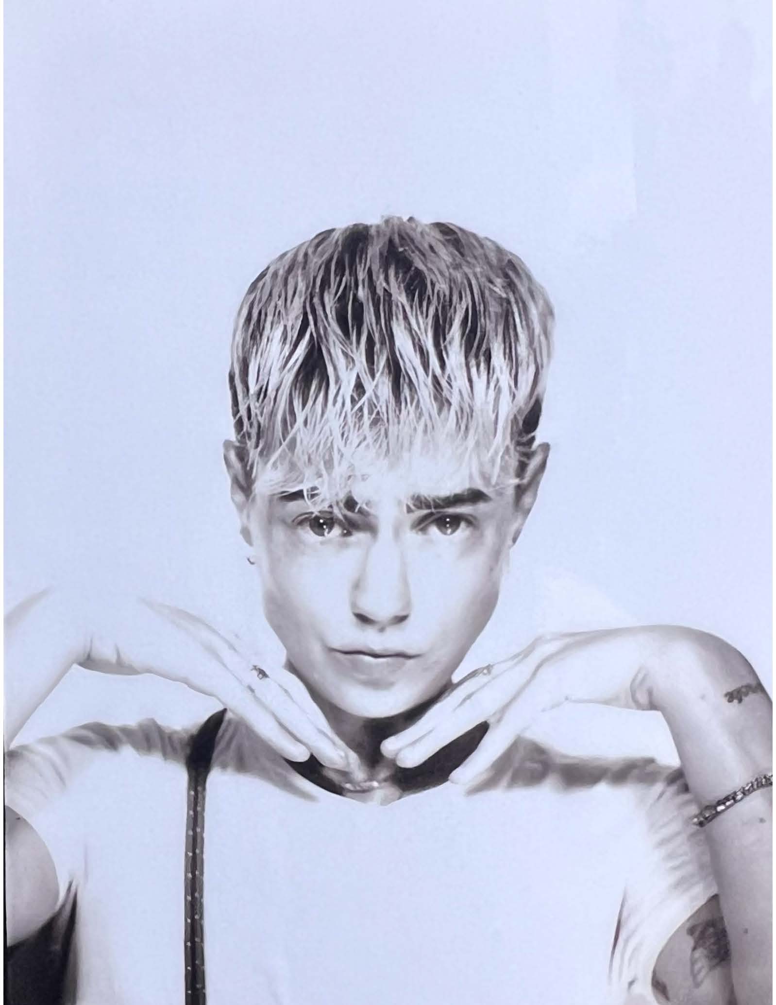 person with short blond hair