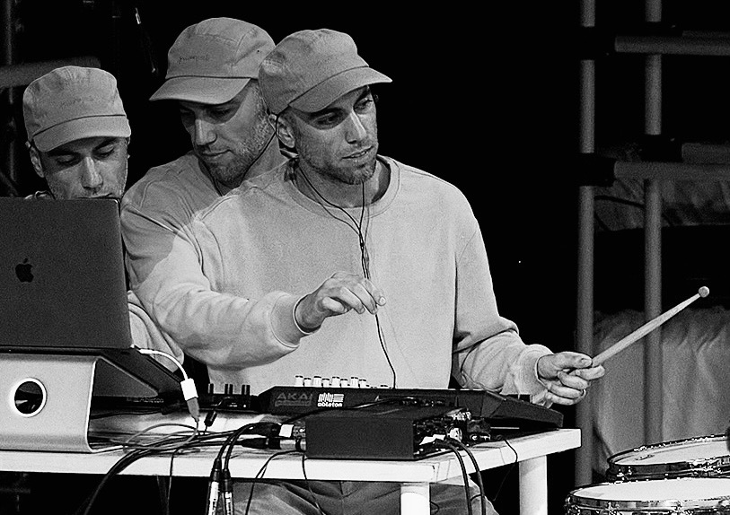 Men with a cap on, creating music