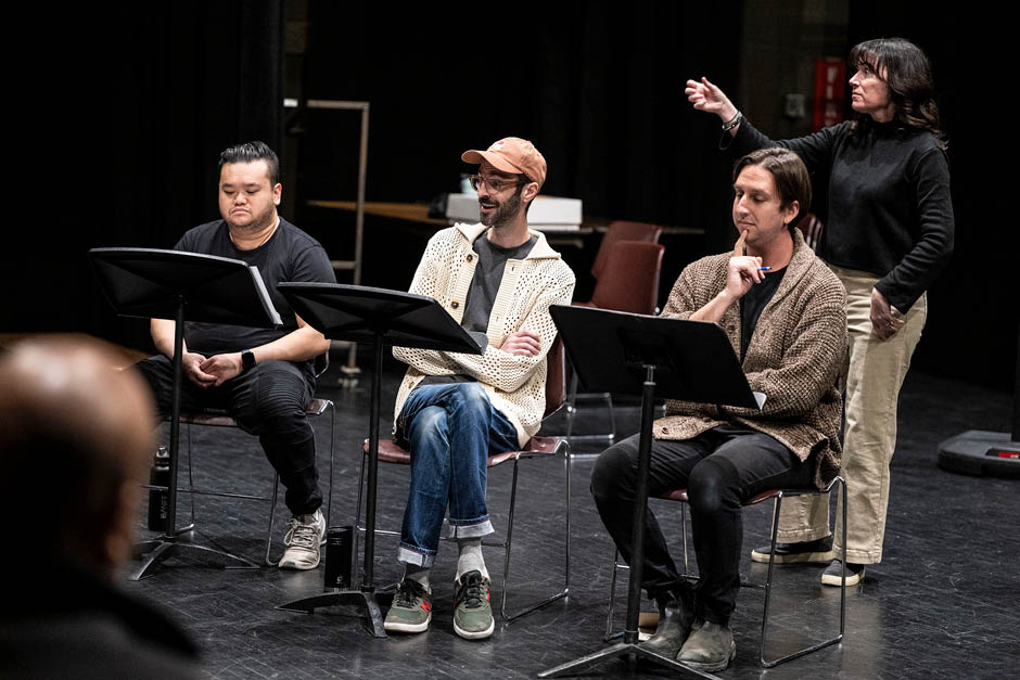 Three actors and an ASL interpreter read through a script together
