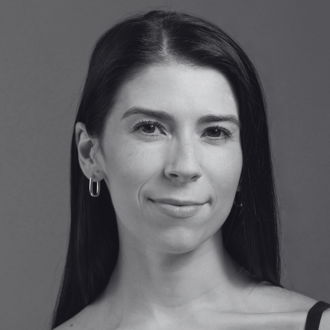 Black and white photo of woman with long hair over shoulders