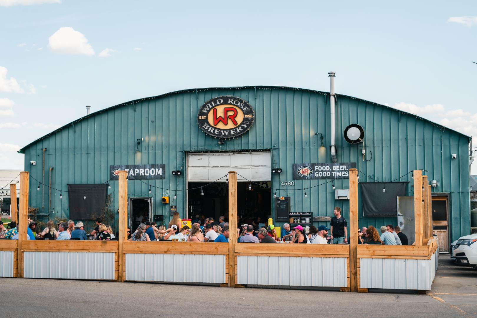 The Wild Rose taproom patio filled with people
