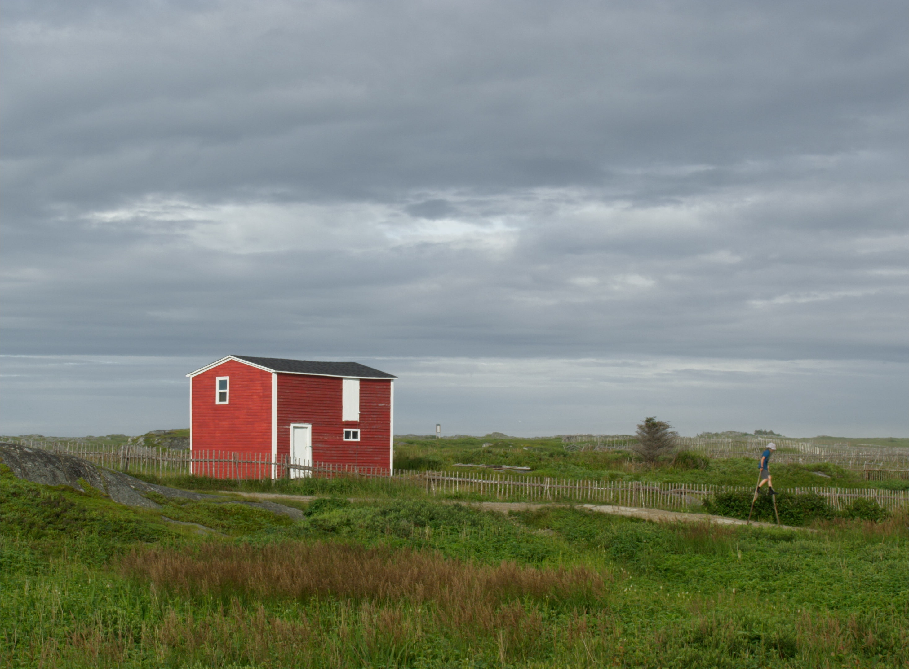 Red building and child on stilts
