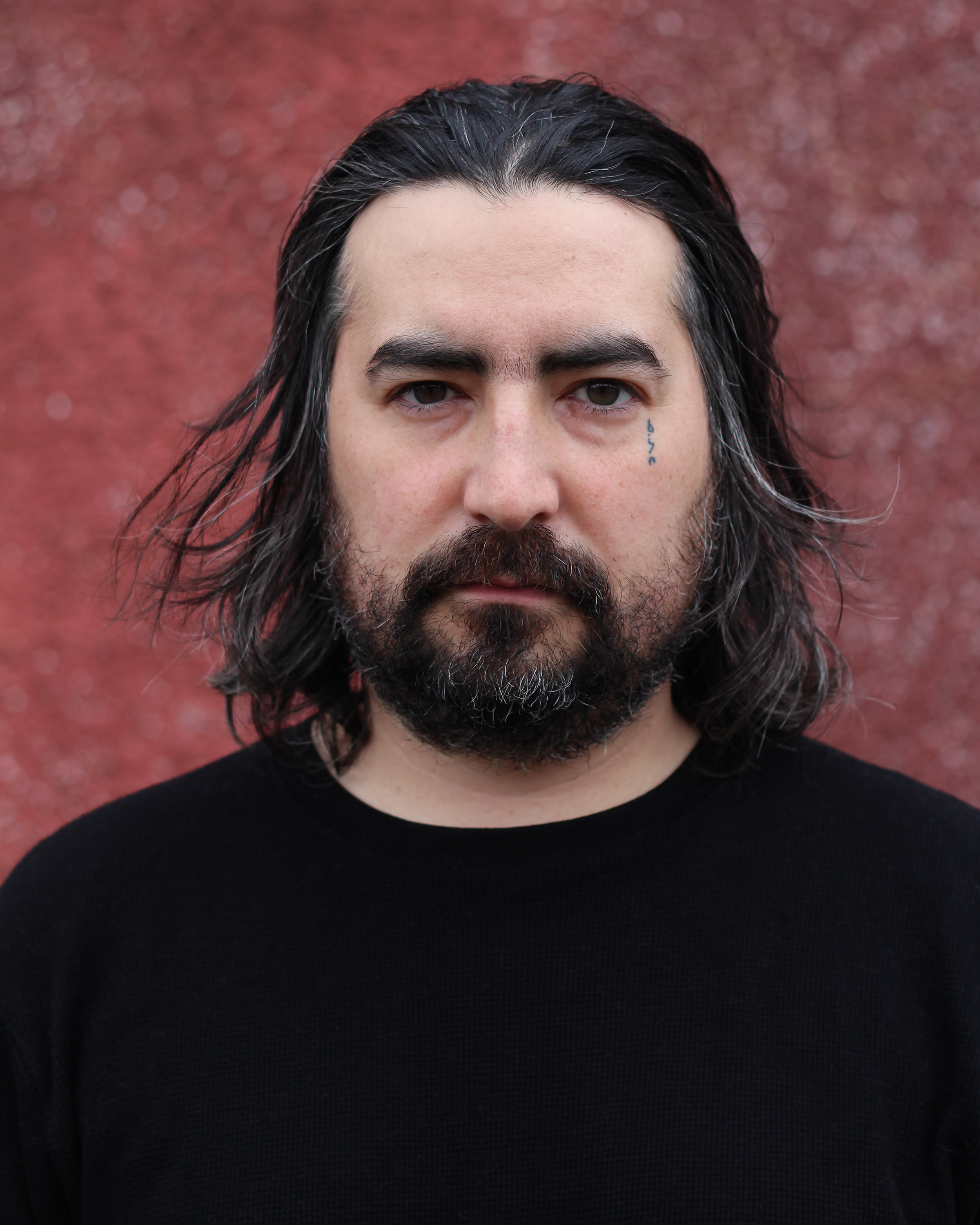Men with long hair wearing black