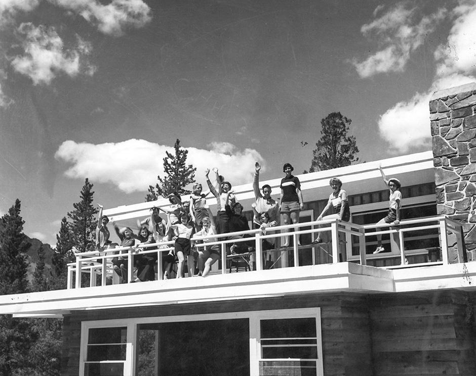 Students waving from the sun deck or Farrally Hall in the summer of 1956