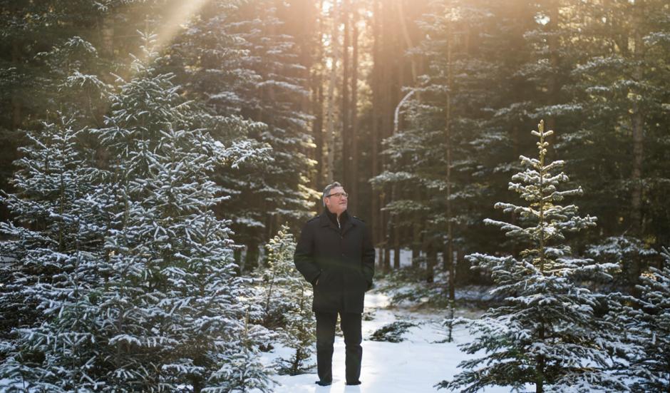 Brian Calliou looks up at Sleeping Buffalo Mountain in Banff, AB. 