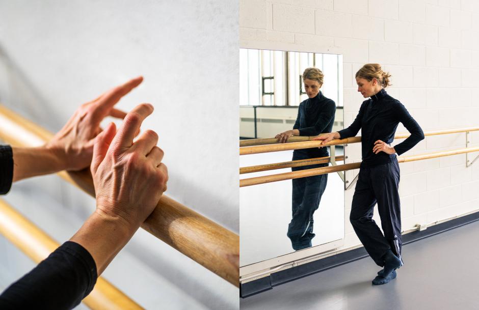 Dance studio with wooden bar and mirror.