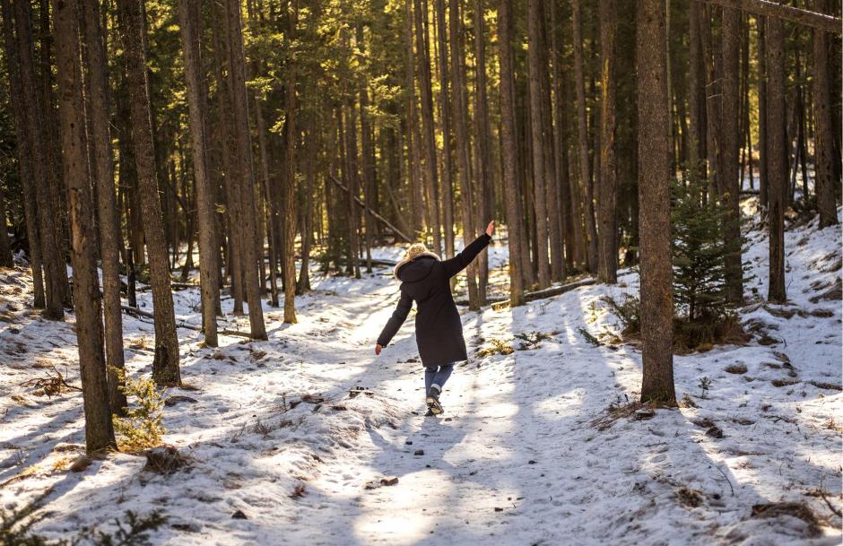 Crystal explores a forest trail.