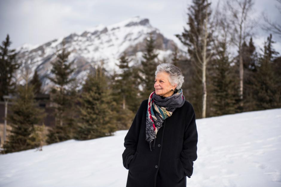 Jenny Belzberg | Cascade Banff Centre donor walking through campus with Cascade in the background.