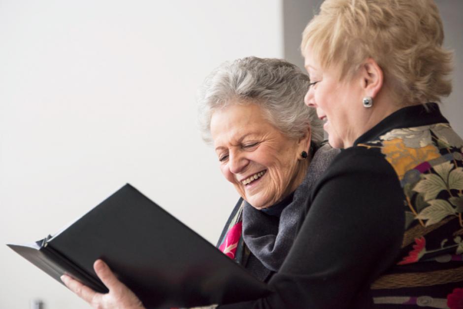 Banff Centre donor and president reflecting on photos. 