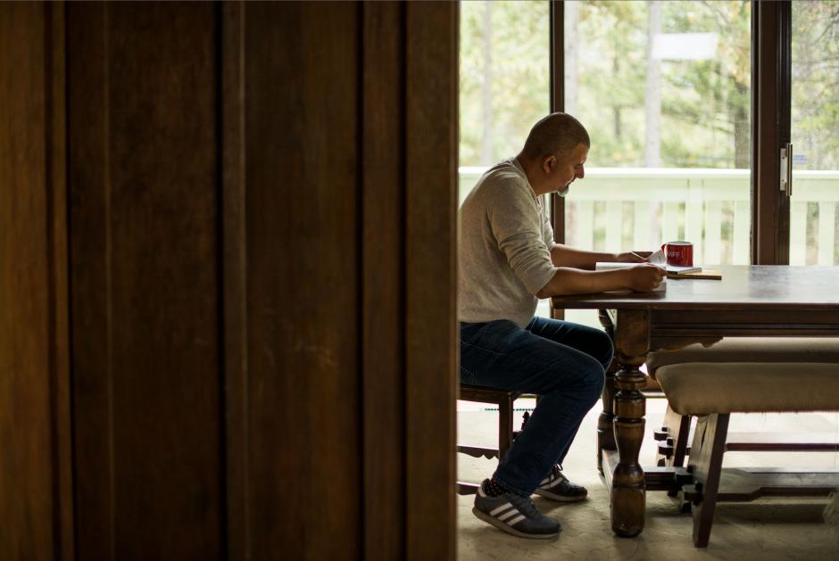 Marcus Youssef writing inside a studio space. 