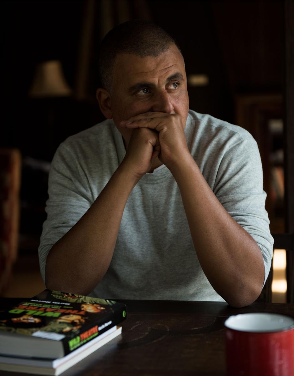 Marcus Youssef working at a table.