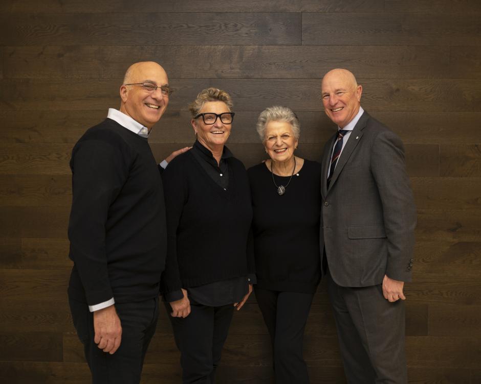 The Belzberg Family Photo of The Belzberg Family standing in front of a wall.