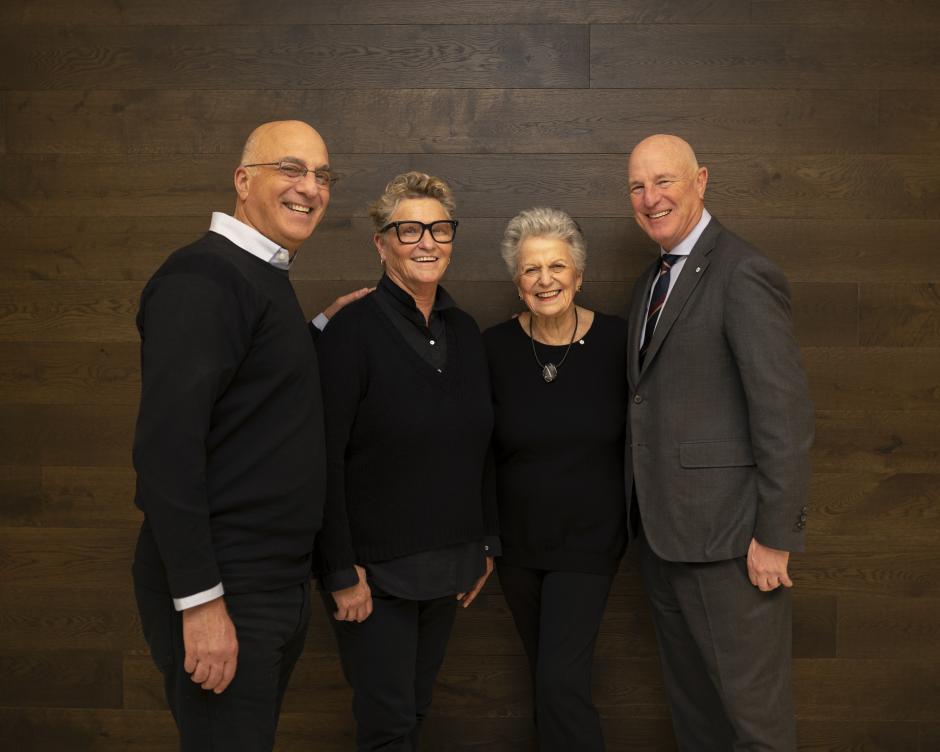 Photo of The Belzberg Family standing in front of a wall. 