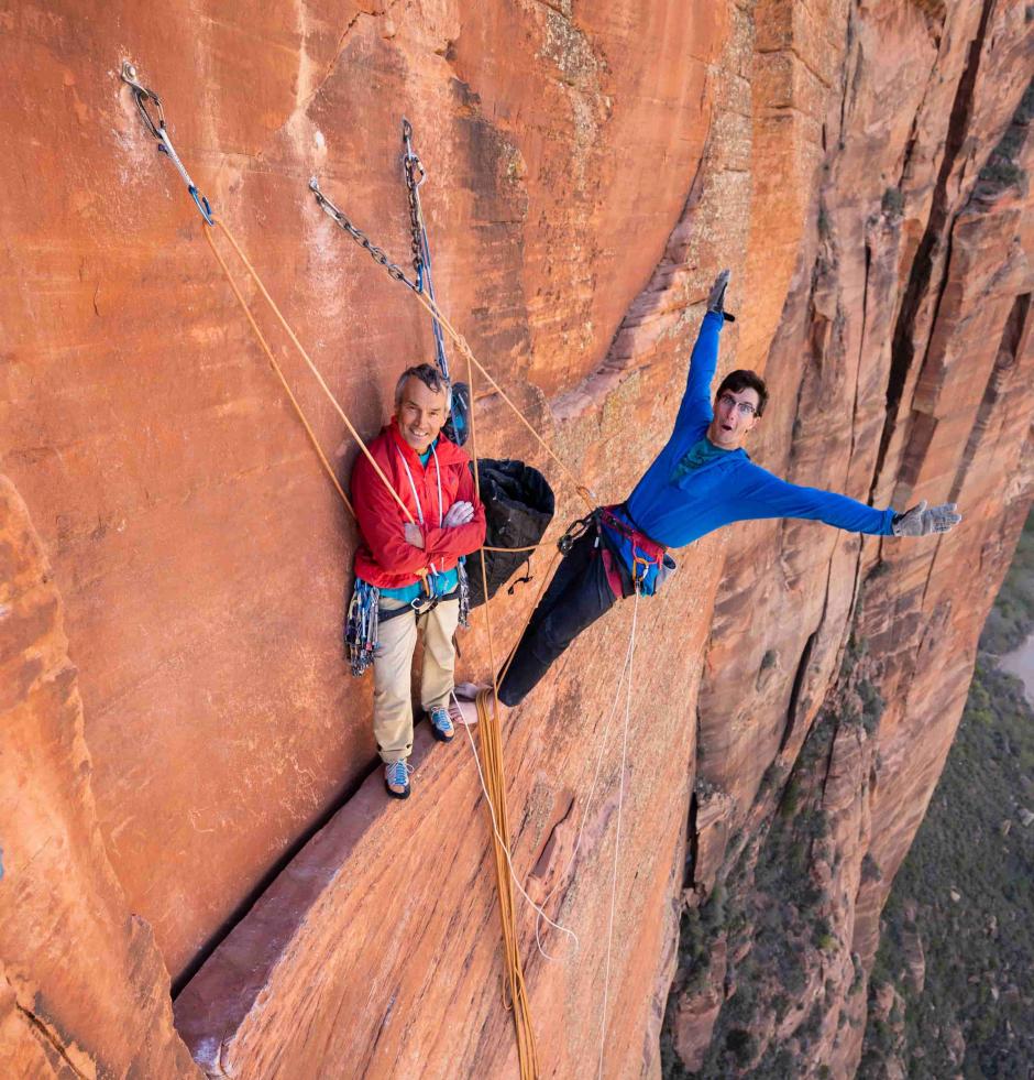 Two climbers are resting on the pitch.