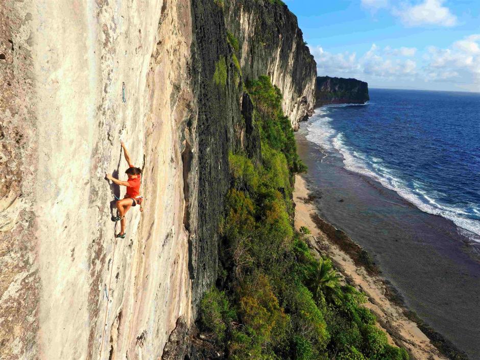Image from the film Makatea Vertical Adventure by Guillaume Vallot A female athlete is climbing on the coast.