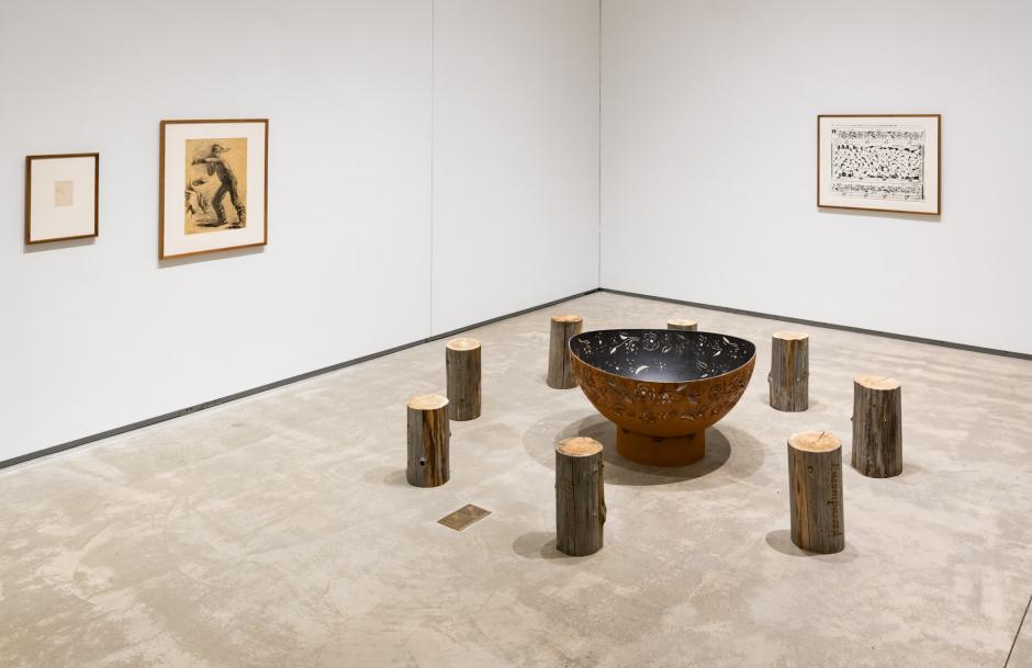 Tania Willard, Surrounded/Surrounding, 2018, wood burning fire ring, laser etched cedar woodlogs from SecwépemcTerritory, relief print on paper. Collection of the artist. Gifted to Four Directions Aboriginal Student Centre, Kingston, 2019. Photo: Paul Lit