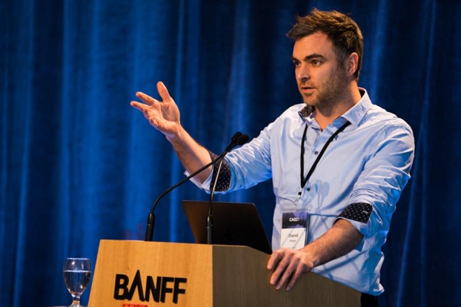 David Maggs stands at a Banff Centre lectern.