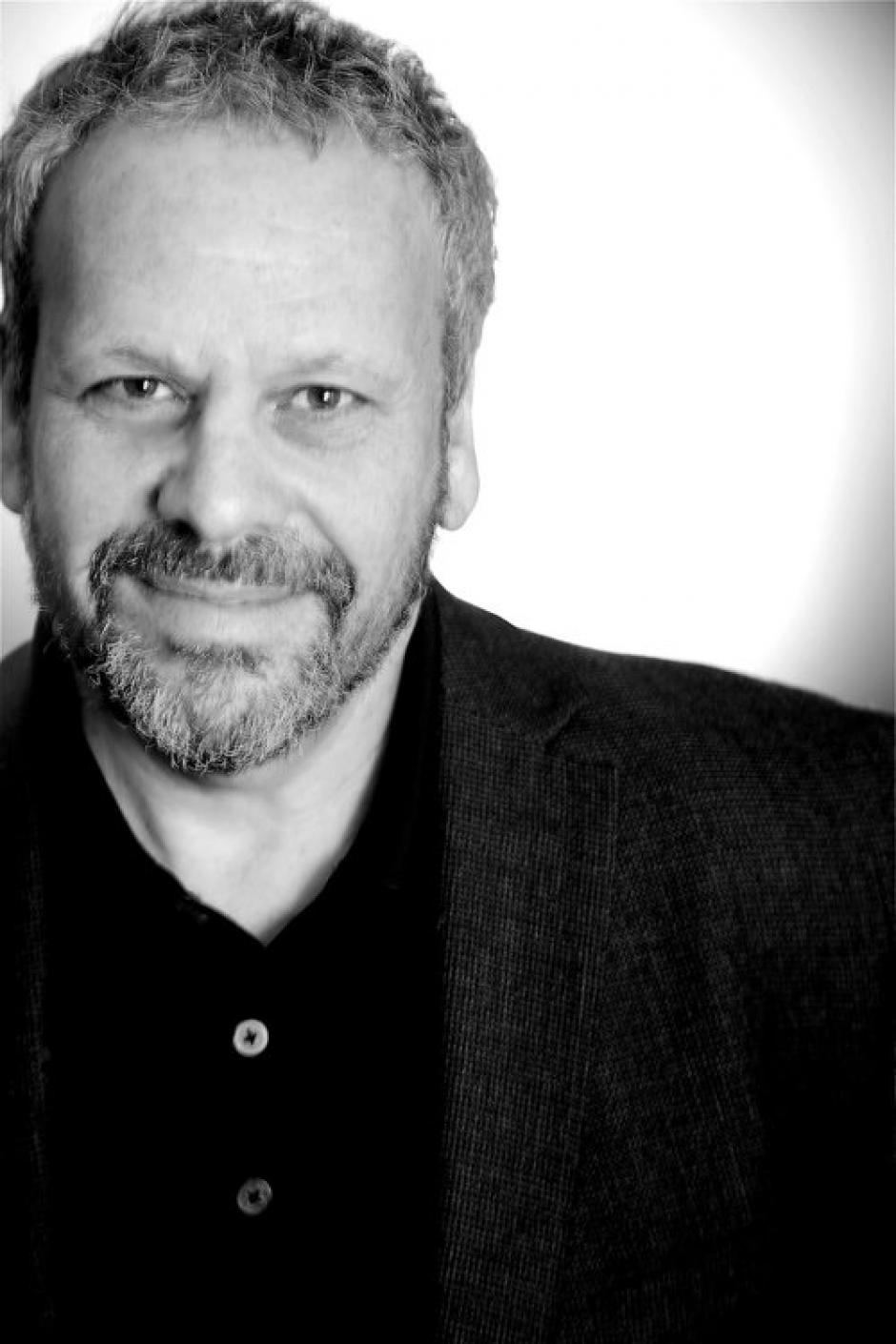 Black and white headshot of Larry Weinstein