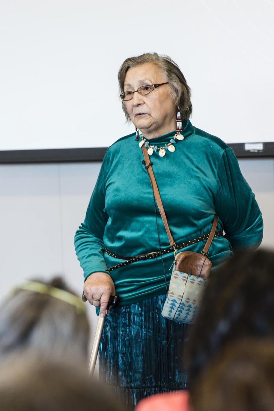 Elder Dila Houle delivers opening remarks at the Hope Decoded summit