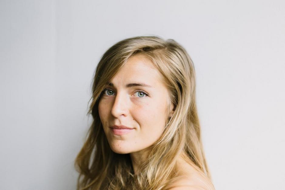 A headshot of Hannah in front of a white background. 