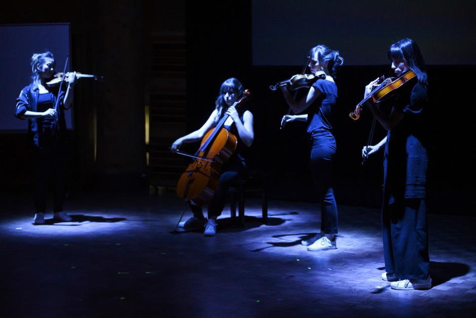 Quartet performing on stage 