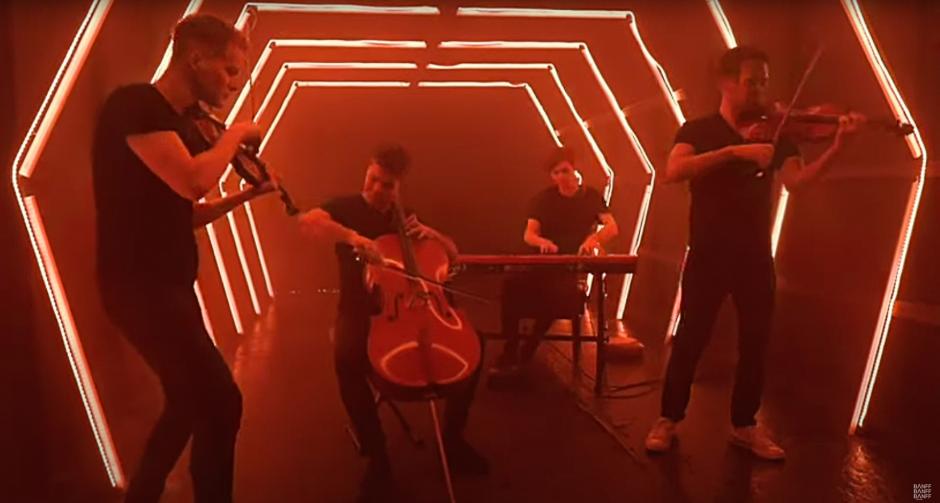 A quartet playing in a lighted tunnel