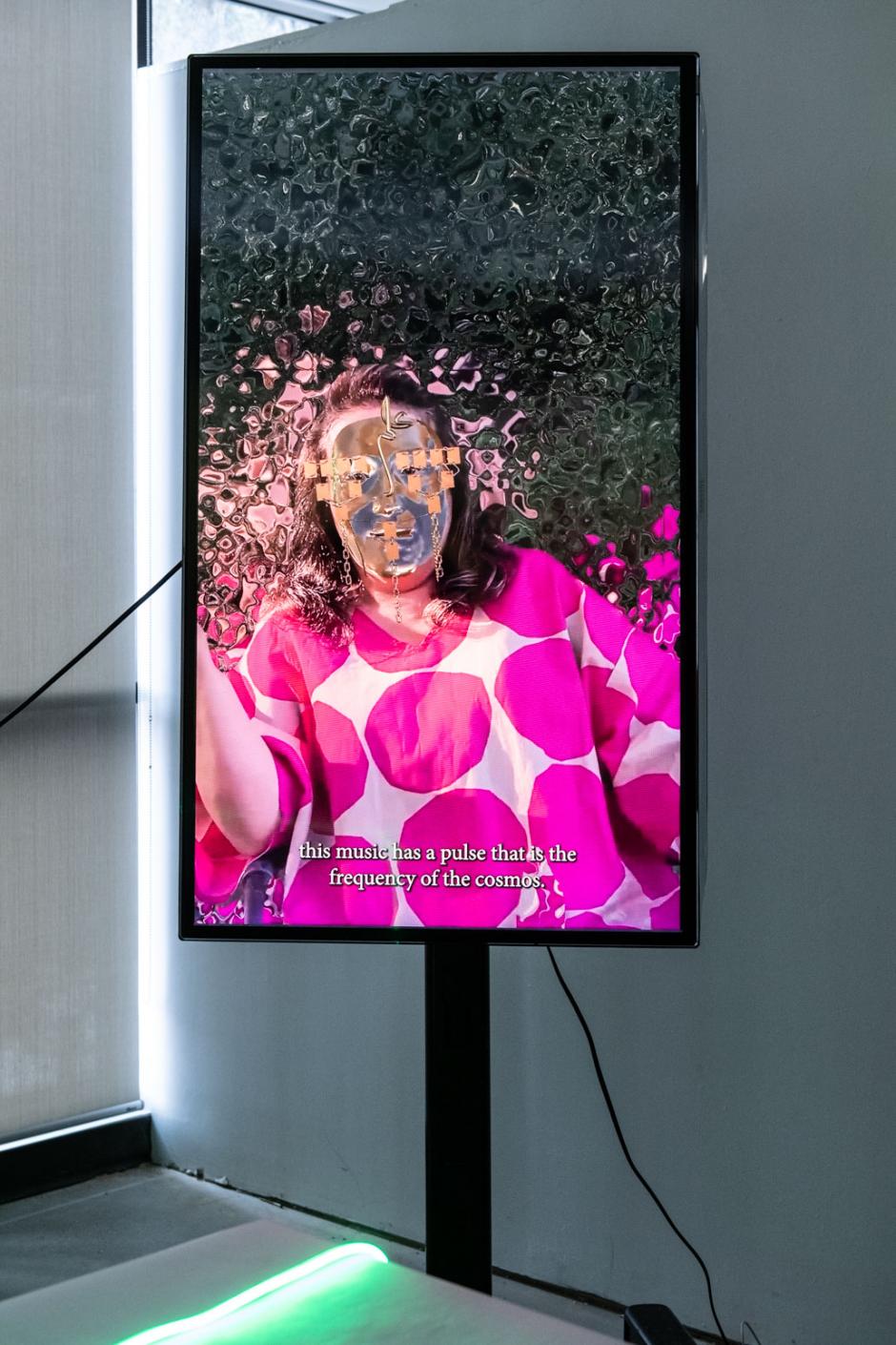 Digital artwork by Shirin exhibited on a vertical screen 