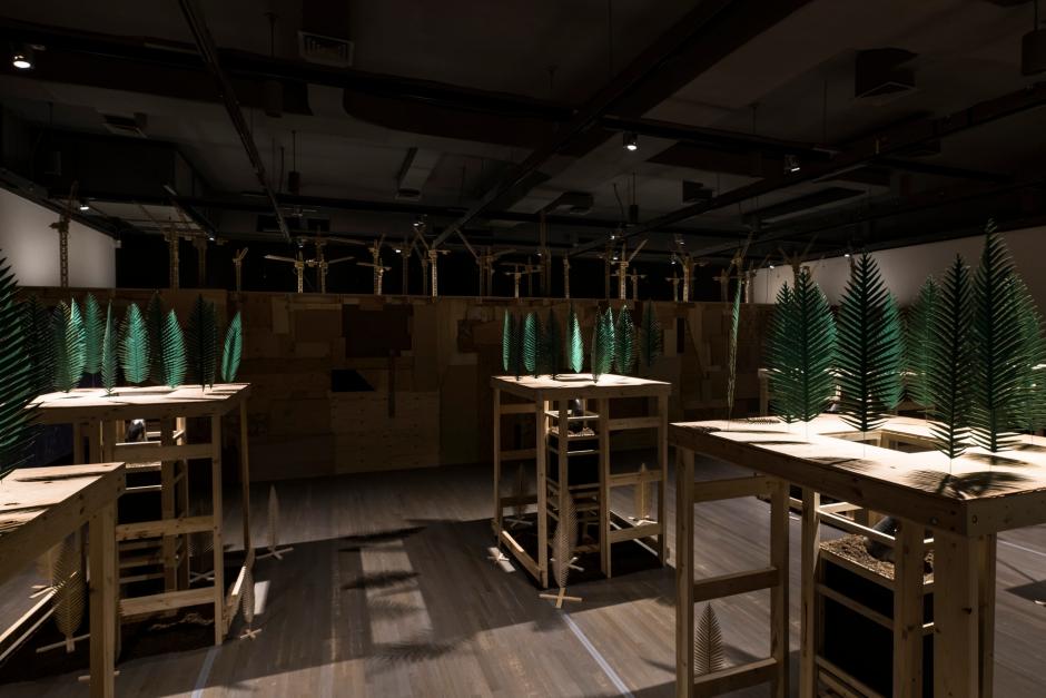 Installation view: Rita McKeough, darkness is as deep as the darkness is (2020), courtesy the artist. Walter Phillips Gallery, Banff Centre for Arts and Creativity. Photo by: Donald Lee. Installation view of Rita McKeoughs exhibition with green ferns