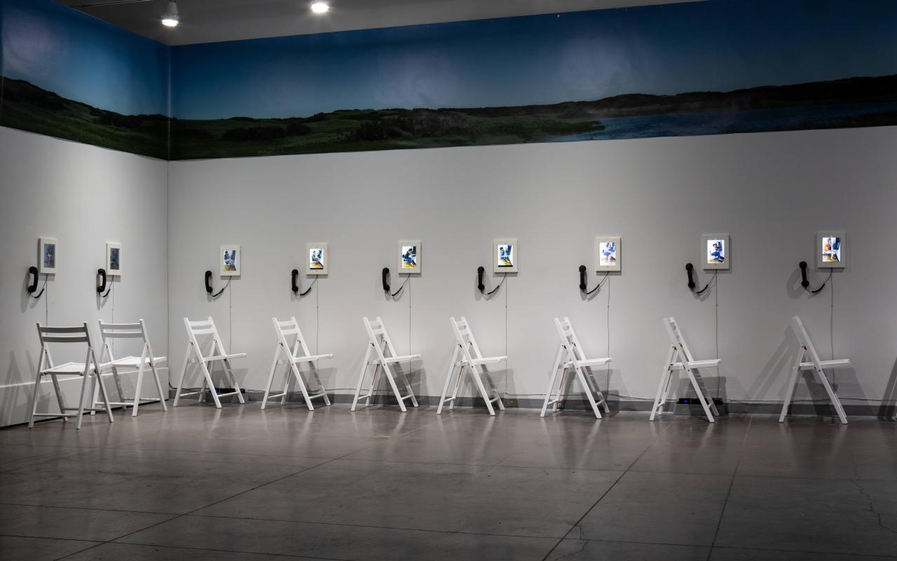 Art installation with chairs and screens