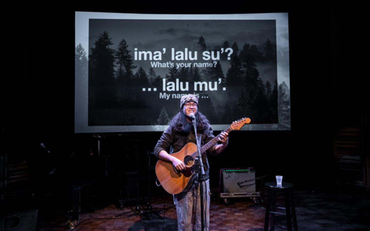 Mauna Delau playing guitar at Wîchoîe Ahiya Concert Participant Concert, 2023, photo by Rita Taylor.
