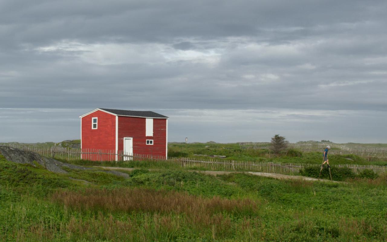 Red building and child on stilts