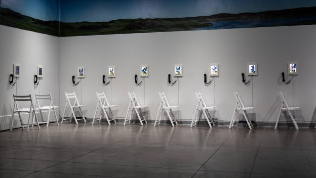 Art installation with chairs and screens