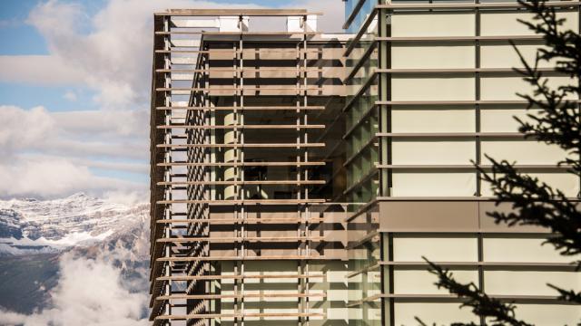 Window feature of the Kinnear Centre with a mountain range in the background. 