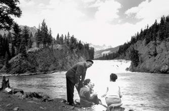Walter J. Phillips with landscape painting students at the base of Bow Falls in 1947