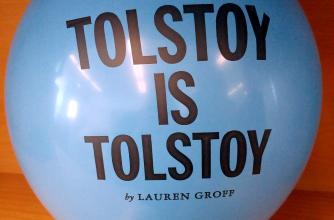 A blue balloon inflated with the text, "Tolstoy is Tolstoy by Lauren Groff," printed on it. 