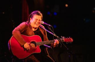 Miranda Currie is pictured singing and playing guitar during a performance at Banff Centre's 2019 Indigenous Arts Singer Songwriter residency