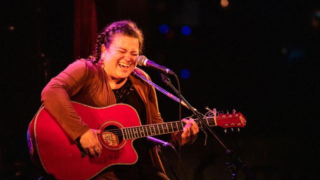 Miranda Currie is pictured singing and playing guitar during a performance at Banff Centre's 2019 Indigenous Arts Singer Songwriter residency