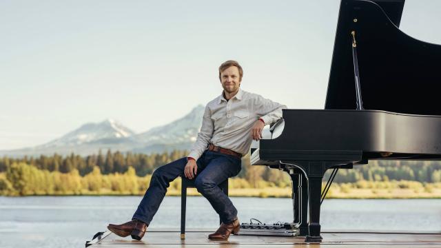 Hunter Noack with lake and mountains landscape