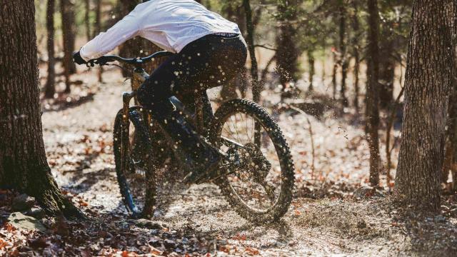 Man biking in forest