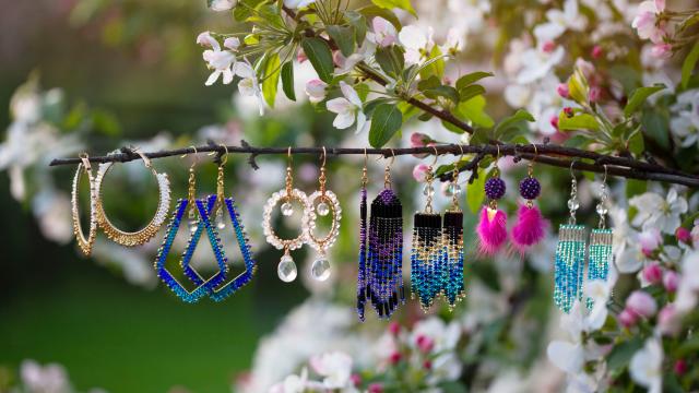 Beaded earrings hanging from a branch