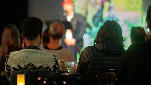 audience seating in an intimate setting and listening  