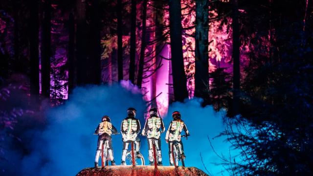Photo of mountain bikers in skeleton costumes