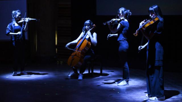 Quartet performing on stage 